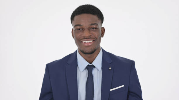 istock African Businessman Smiling at Camera on White Background 1364007917
