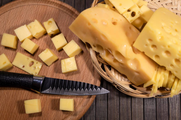 istock a round board with pieces of cheese and a knife 1364009395