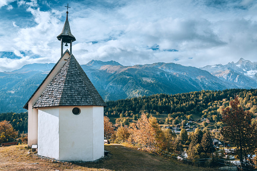 Church in Village landscape by mountain\nMuehlebach, Switzerland, Europe