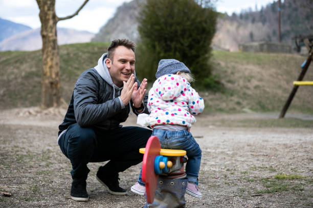 istock Child playing in the park at playground 1364013811