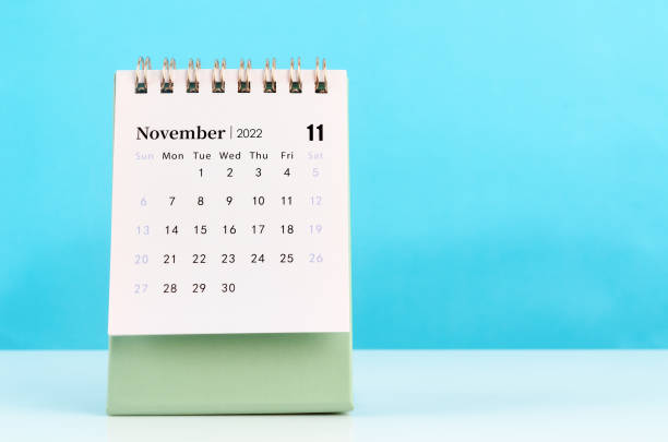 istock November 2022 desk calendar on blue background. 1364015101
