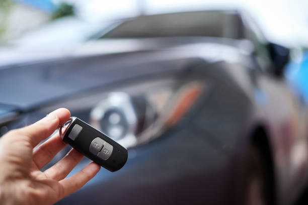 istock The car owner holds in his hand a remote control device for keyless entry. Close-up, selective focus 1364016220