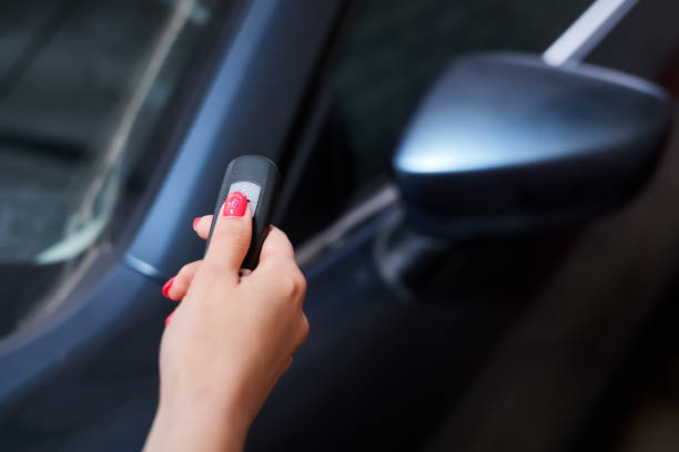 istock The car owner holds in his hand a remote control device for keyless entry. Close-up, selective focus 1364016274