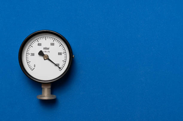 istock close up of pressure gauge on blue table background, engineering equipment concept 1364017949