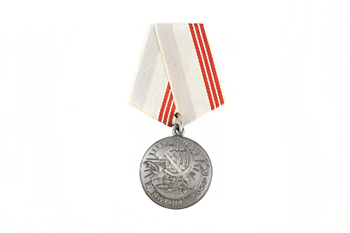 Soviet medal for labor veteran on white background