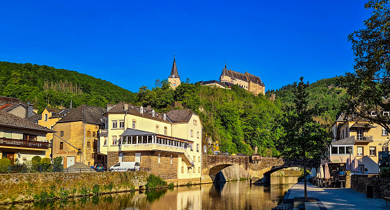 The view north-west up the river Our to the village and Vianden Castle on the hills in the background, Vianden, Luxembourg