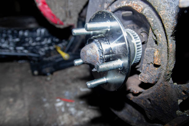 istock new wheel hub on old car. 1364019629