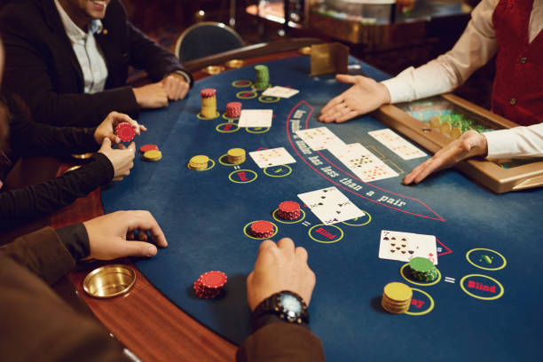istock People gamble at a poker table in a casino. 1364021443
