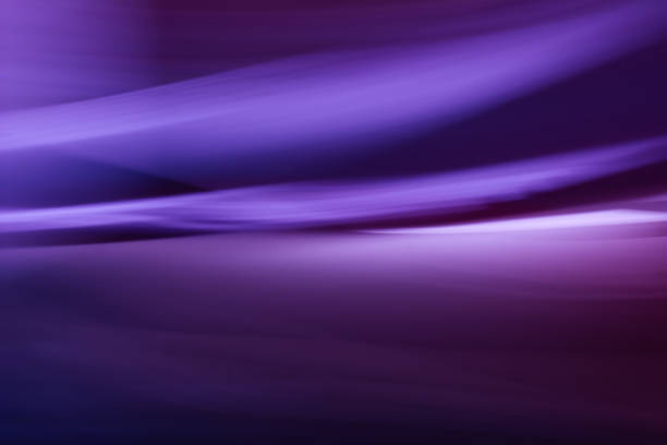 Horizontal purple festive background with waves, lines, highlights and slight blur. Nightly abstraction created at high speed. Backdrop with a gradient.