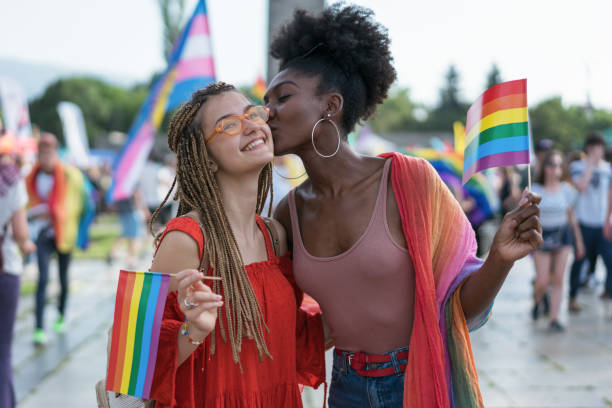 istock Interracial couple at the pride parade 1364027422