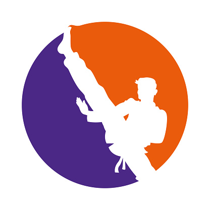 Vector Illustration of a Martial Art Kicking Striking High Symbol Logo Clip Art