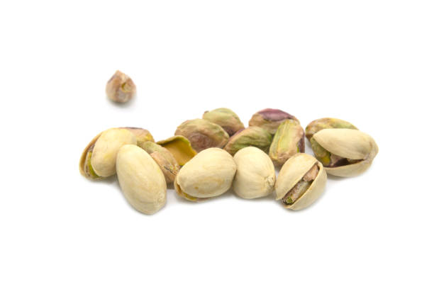 istock Green pistachios isolated on a white background. 1364030741