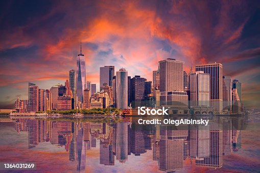 istock New York City Skyline with Manhattan Financial District, World Trade Center and Orange and Blue Sunset Sky. 1364031269