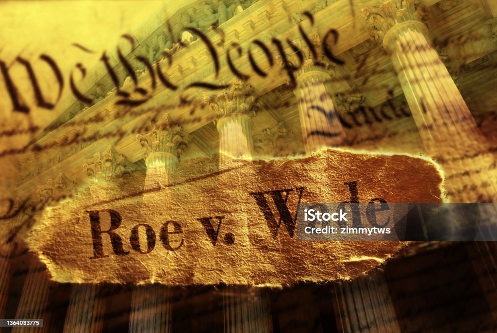 Roe V Wade newspaper headline on the United States Constitution and Supreme Court Roe V Wade newspaper headline on the US Constitution with the United States Supreme Court in background Roe v. Wade Stock Photo