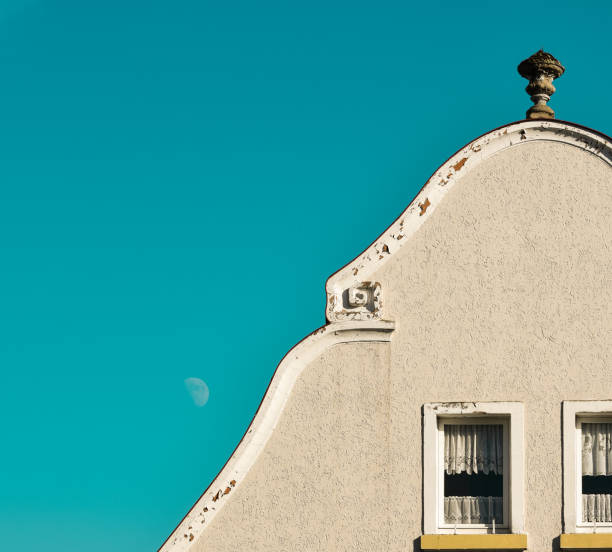 istock white house facade and blue sky. 1364033984