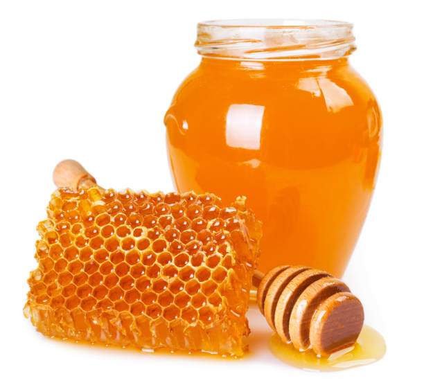 istock Honey with honeycomb on white background 1364034332