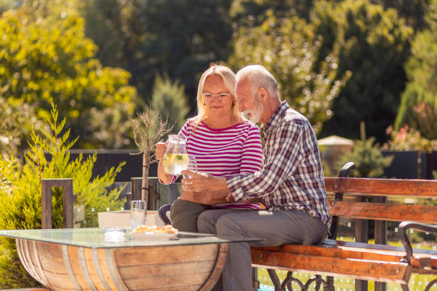 istock Senior couple drinking lemonade in the backyard 1364034498