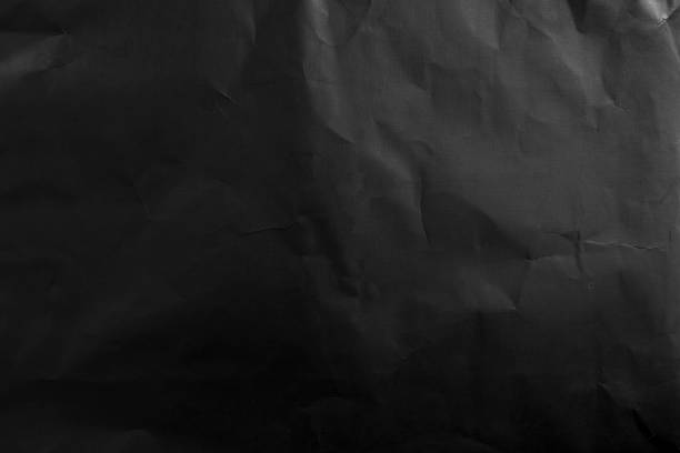 istock black wrinkled paper texture and background. top view 1364038533