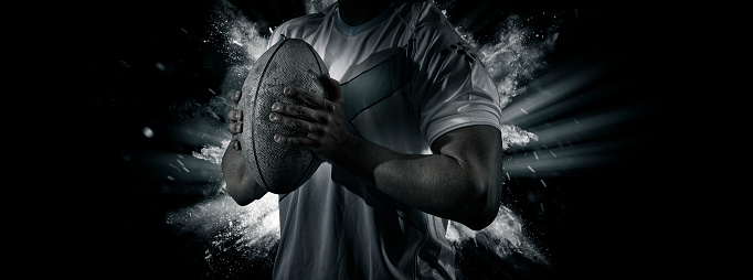 Man rugby player holds ball. Sports banner. Horizontal copy space background