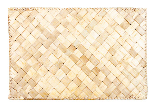 Brown wicker woven table mat isolated on white background
