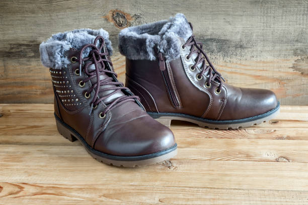 istock Comfortable winter boots with lacing and zipper closure. 1364051023