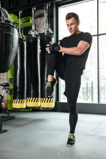 istock Concentrated serious young sportsman make stretching exercises 1364053332