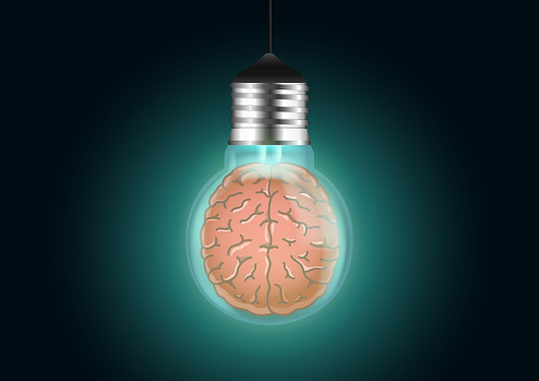 Light bulb with a brain inside glows in dark. with a green. Abstract illustration about Ideas, creativity, and concentration.