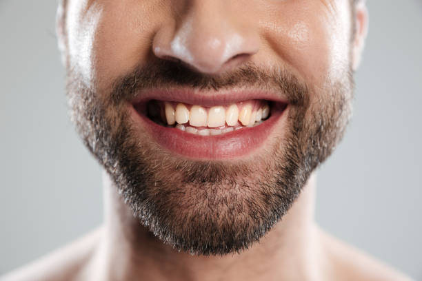 istock Cropped image of a laughing mans face 1364053898