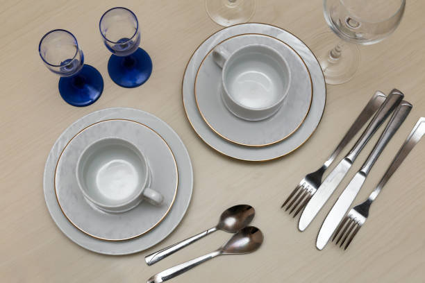 istock Set of dishes on the table for two persons 1364054069