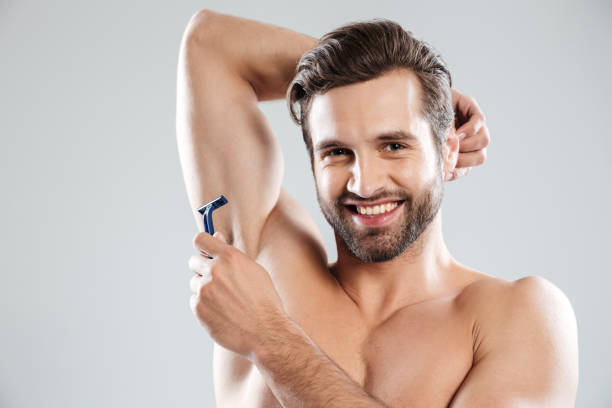 istock Smiling man with razor smiling to camera 1364054644