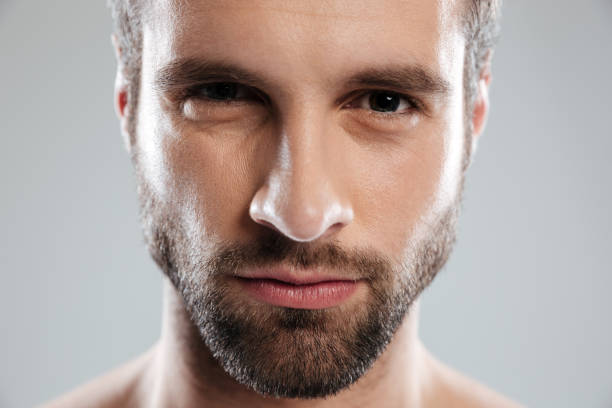 istock Sexy young bearded man face looking at camera 1364054871