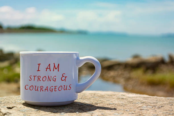 istock Motivational and Inspirational quote on a notepad with blurred beach background 1364054976