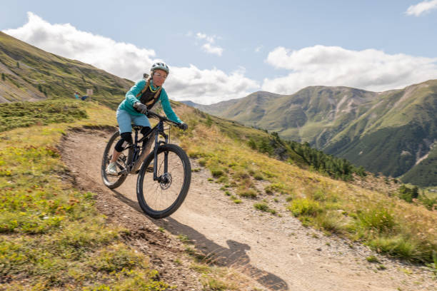 Mountain biker curving on downhill trail