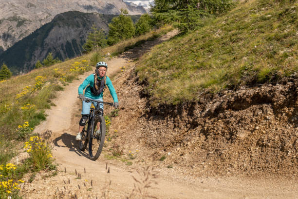 istock Mountain biker curving on downhill trail 1364057388