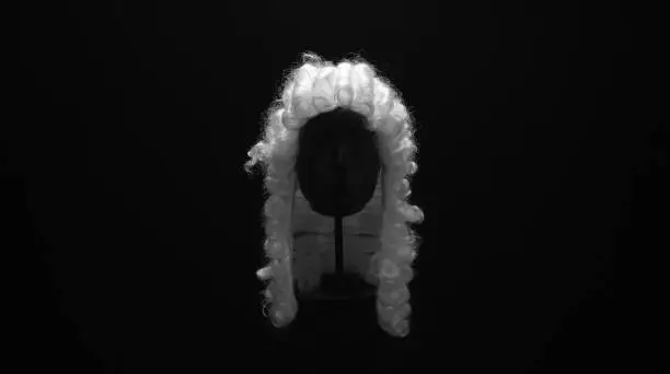court wig on a black background