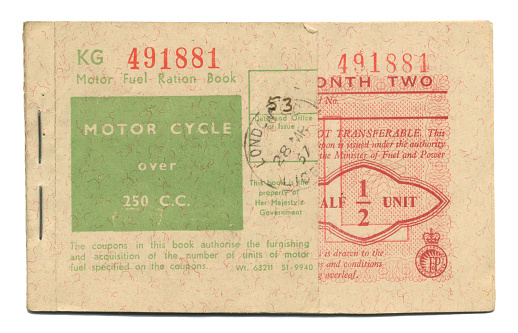 A British Motor Fuel Ration coupon book dated 1957 for a motor cycle over 250cc. Some of the cover has been cut off, showing part of a coupon inside for half a unit of fuel. These books were issued during the ‘Suez Crisis’ of 1956-57, when petrol rationing was brought in. Egypt’s President Nasser seized the running of the Suez Canal from a Franco-British company after being refused money to build the Aswan High Dam because of his links with the USSR. Consequently, supplies of petrol were affected and it was necessary to impose petrol rationing for five months.