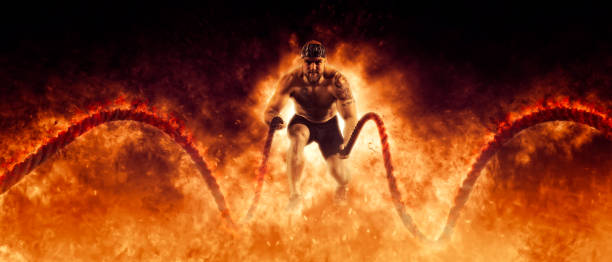 istock Muscular man working out with battle ropes 1364066989