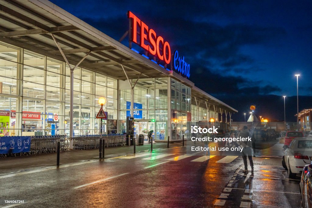 Tesco extra superstore exterior Greenock, Scotland - People outside the main entrance to a large Tesco extra superstore. Tesco Stock Photo