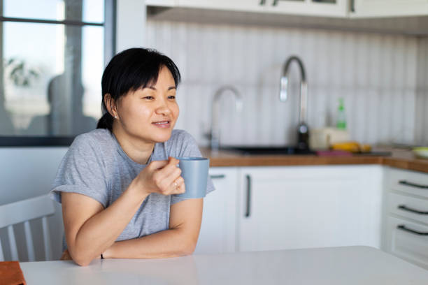 istock Korean woman drinking tea at home 1364068091