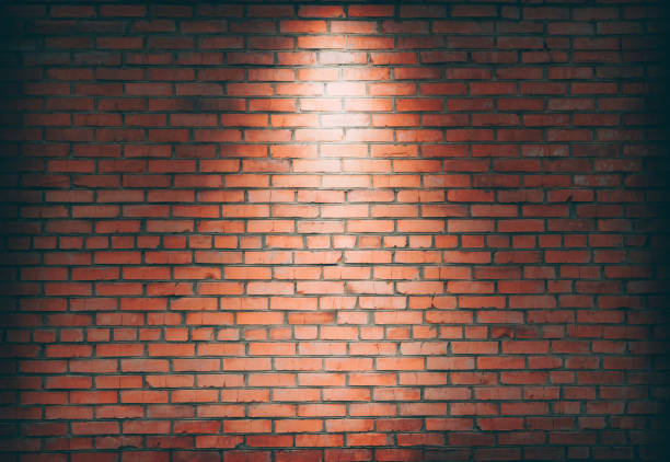 istock Empty space of Studio dark room black brick wall grunge texture background. Spotlight on a brick wall. 1364068767