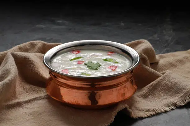 Raita is a side dish in Indian cuisine made of dahi together with raw or cooked vegetables.