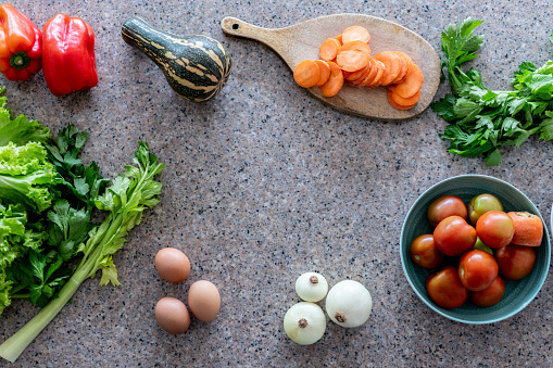 Beautiful kitchen counter top with colorful fresh vegetables - View from above