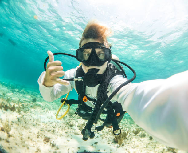 istock young dive instructor taking a selfie in the caribbean ocean 1364072875