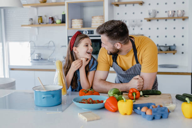 istock Father and daughter in the kitchen 1364074726