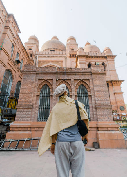 istock Man walking near the mosque in Lahore 1364075866