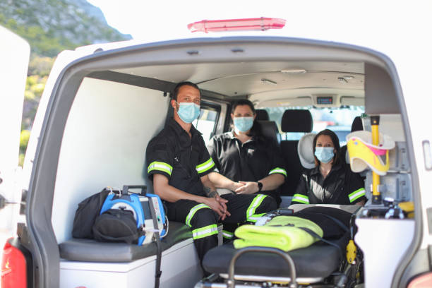 istock a Group of paramedics sitting in an ambulance. 1364077000