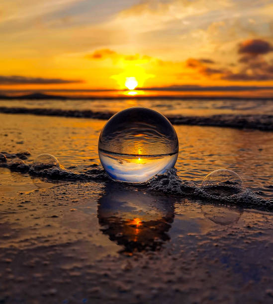 Glassball sunset tide Glassball as the tide comes in during the sunset in Orkney orkney islands stock pictures, royalty-free photos & images