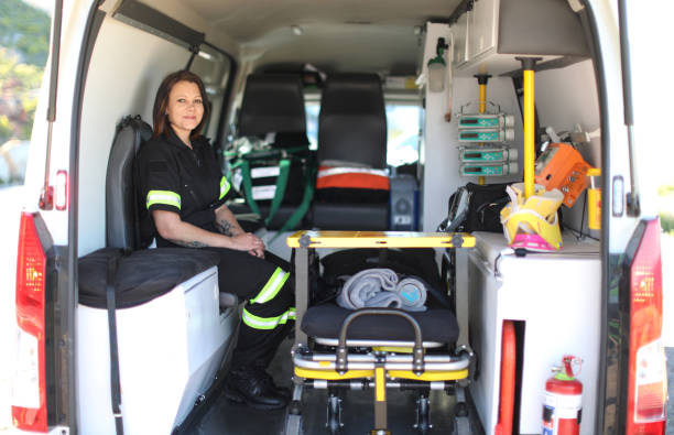 istock A Female paramedic sitting inside an ambulance looking at the camera. 1364081281
