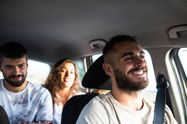 istock A happy young man on a road trip with his friends 1364082920