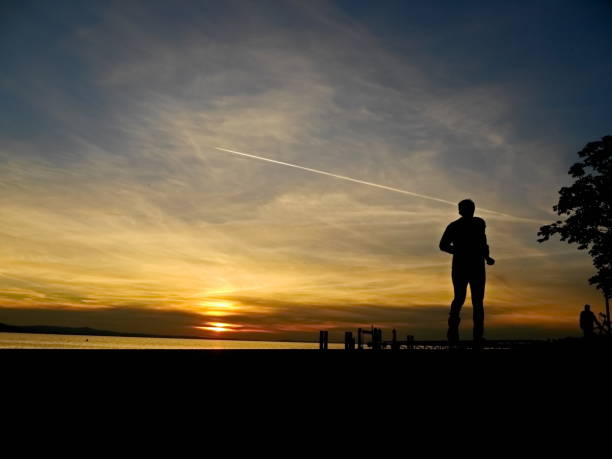 istock silhouette of a jogger 1364082948